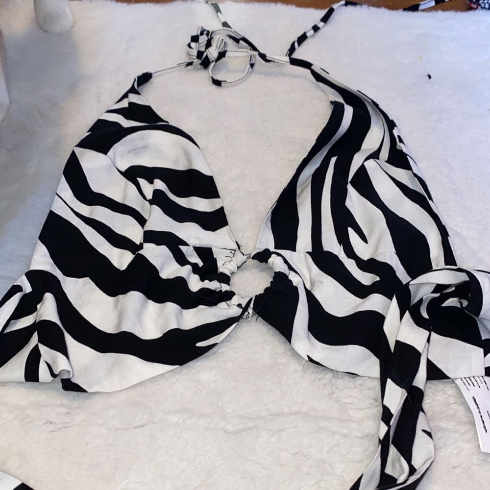 BRAND NEW ZEBRA HALTER TOP WITH RING IN MIDDLE. TIES AT TOP AND BOTTOM.
